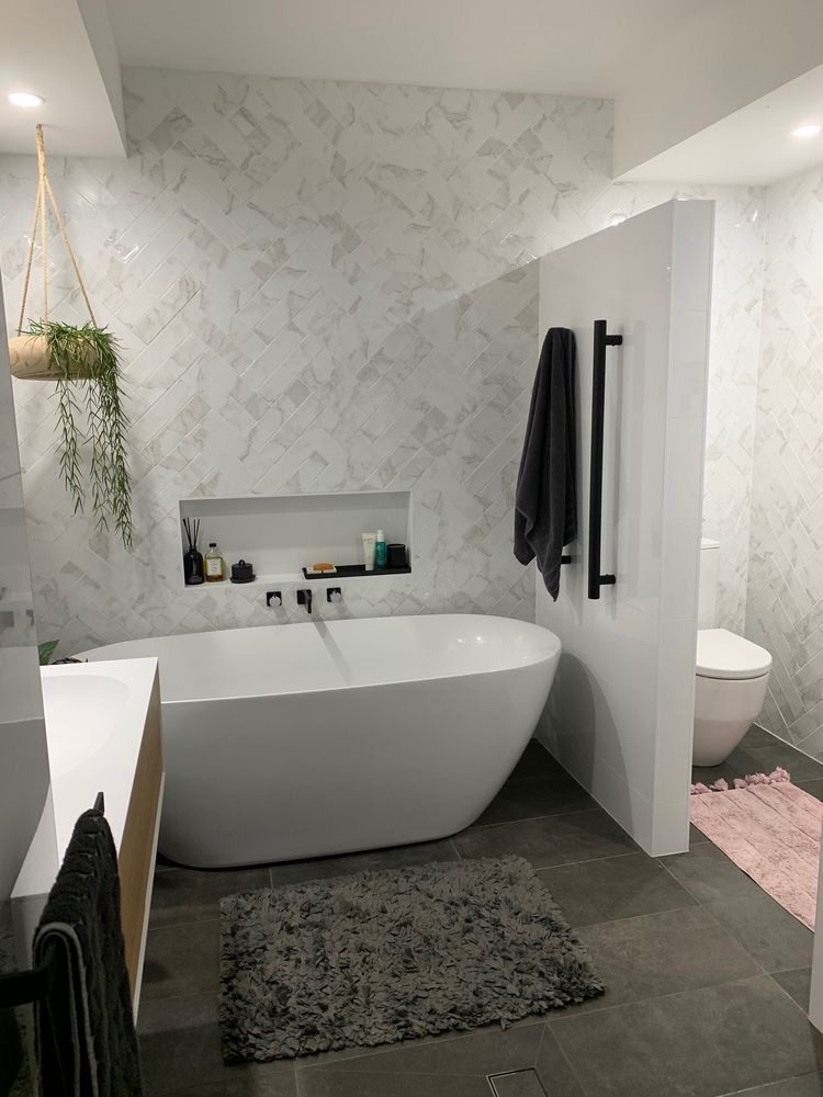 Image of a stylish bathroom with a modern designer tub.