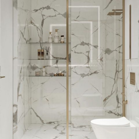Luxurious marble bathroom with glass shower and modern fixtures.