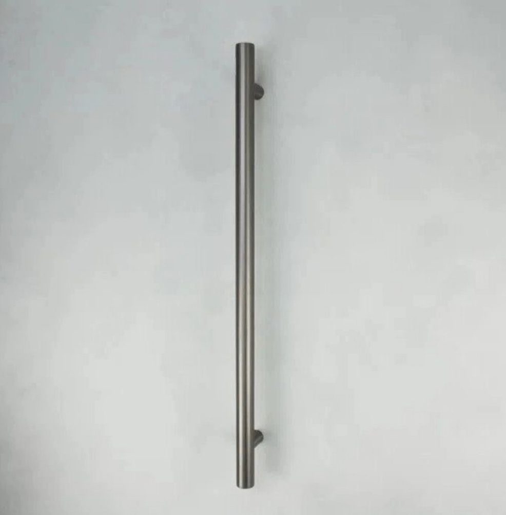 Silver metal door handle on a light gray background.