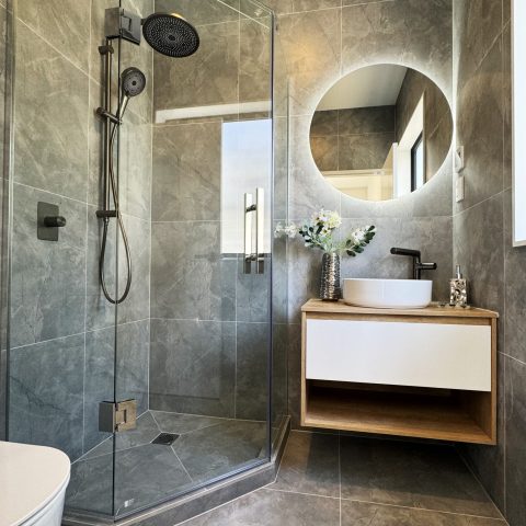 image of a gray tiled bathroom