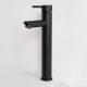 Black modern faucet against a white background.