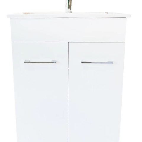 White bathroom vanity with two doors and silver handles.