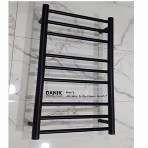 Black towel rack on white marble floor.