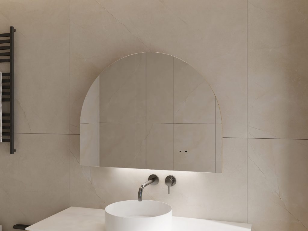Arched mirror above a white sink with wall-mounted faucet.