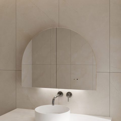 Arched mirror above a white sink with wall-mounted faucet.