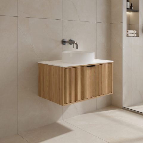 Modern bathroom with wooden floating vanity and round sink.