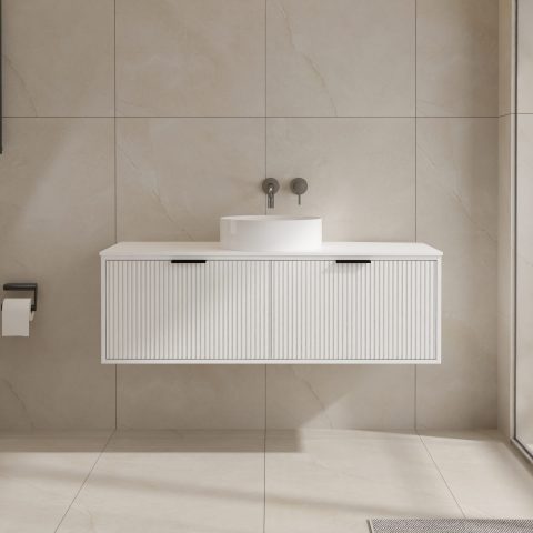 Modern bathroom with wall-mounted white vanity and round sink.