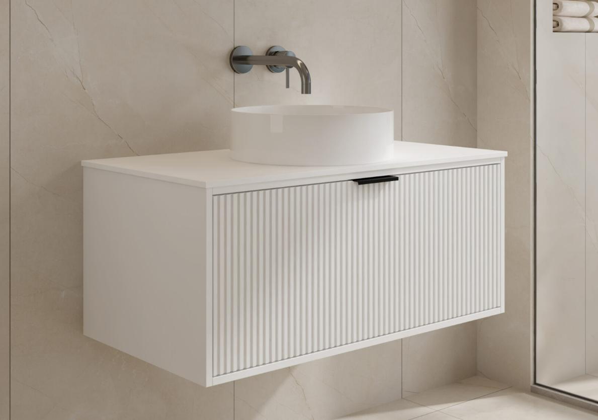 Modern white bathroom vanity with round sink and wall-mounted faucet.