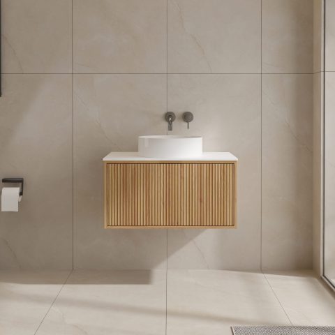 Modern bathroom with wooden vanity, round sink, and wall-mounted faucet.
