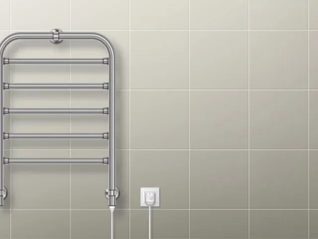 A heated towel rail in chrome finish.